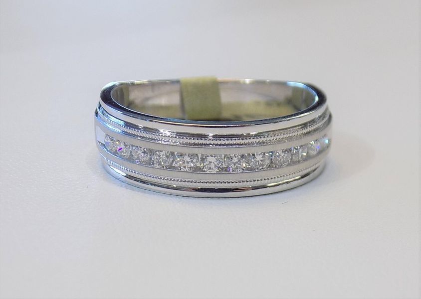 White gold ring with a row of small diamonds