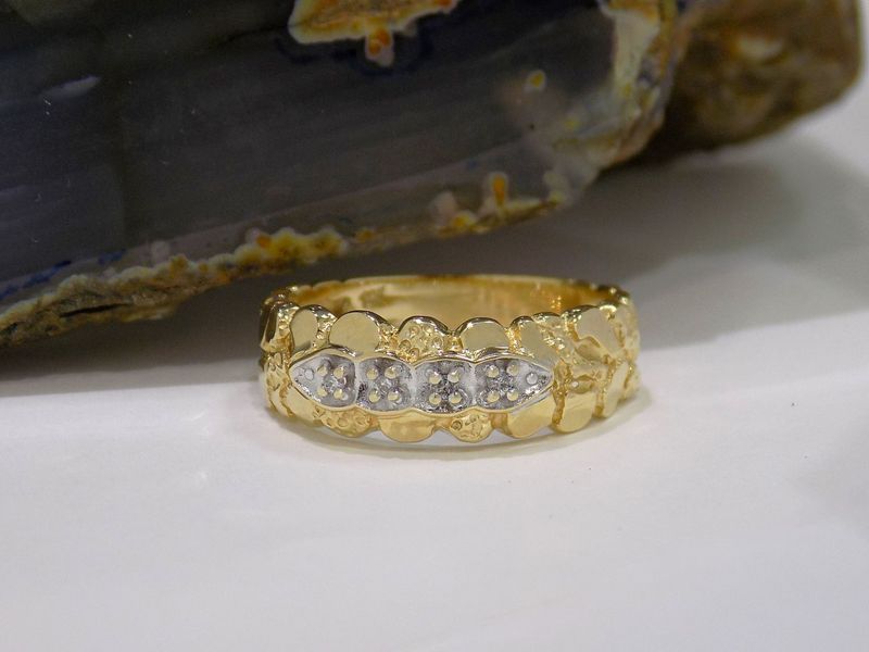 Gold nugget-style ring with five small diamonds