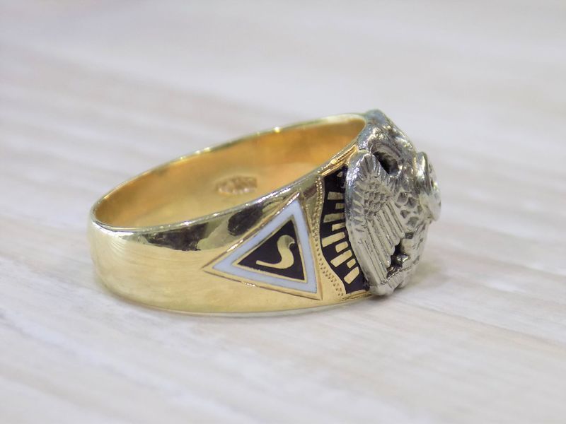 Gold ring with white triangle