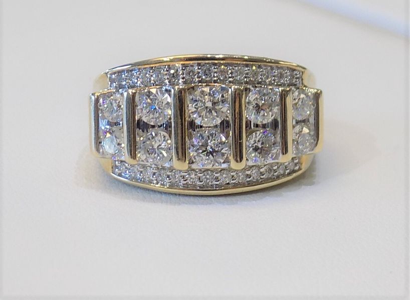 Gold ring with many diamonds set in it