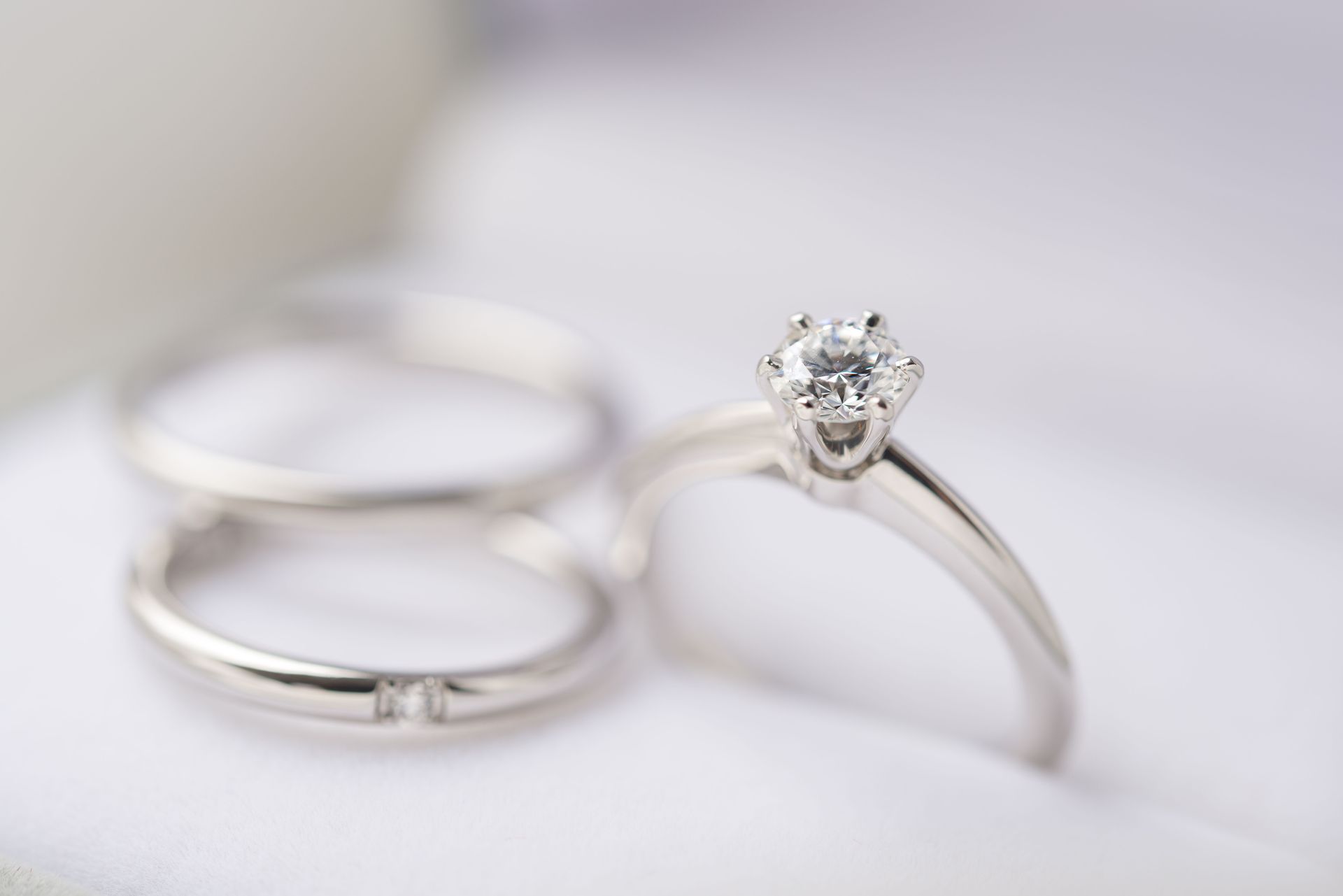 Diamond engagement ring with two plain wedding bands