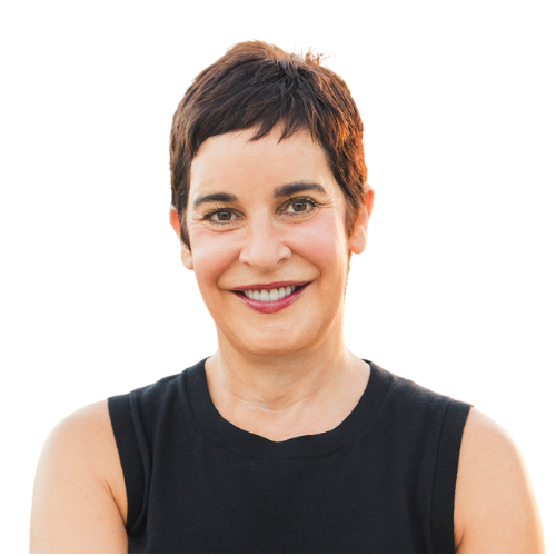 A woman with short hair is smiling and wearing a black tank top
