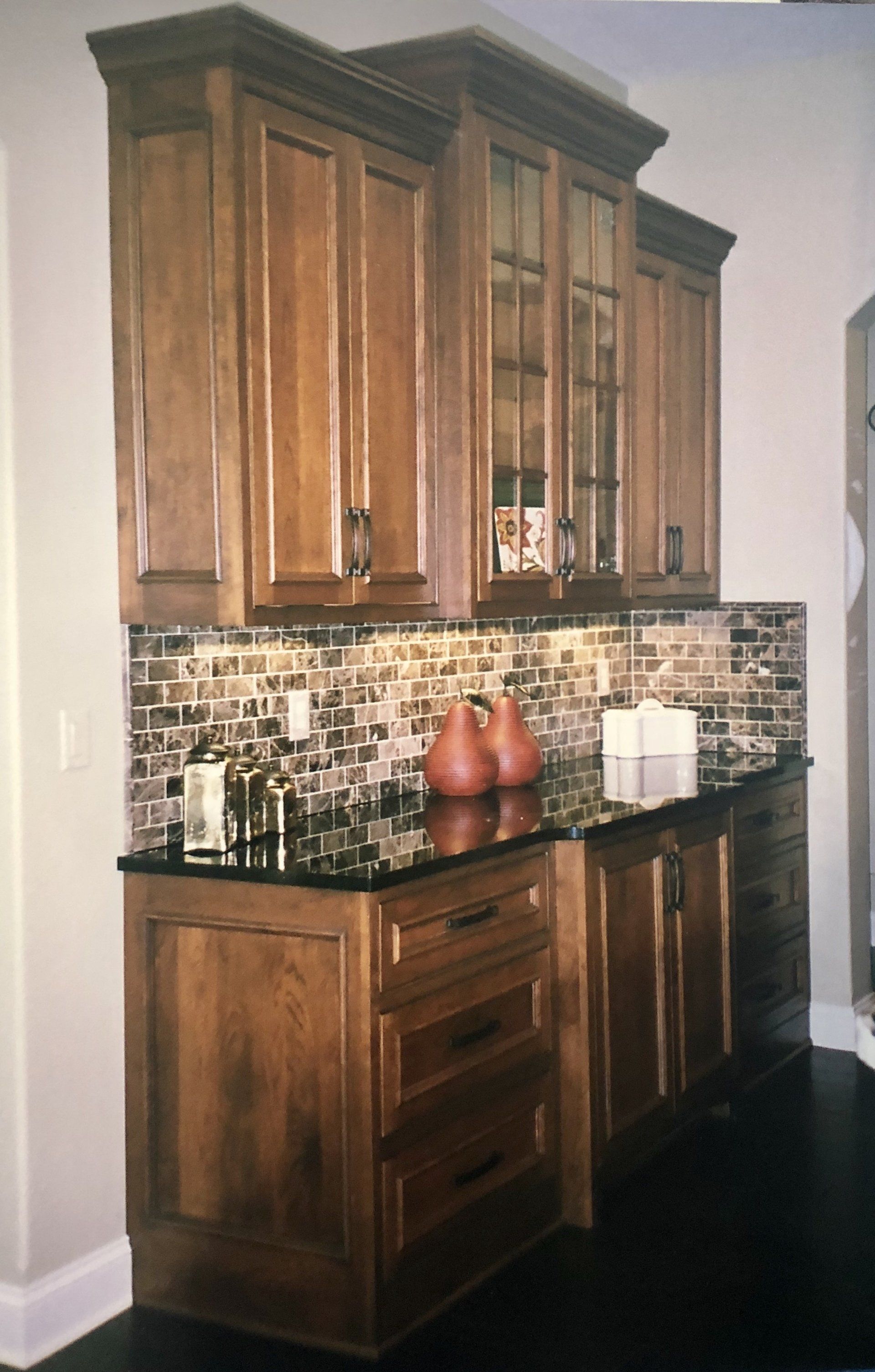 Wooden cabinets with a backsplash