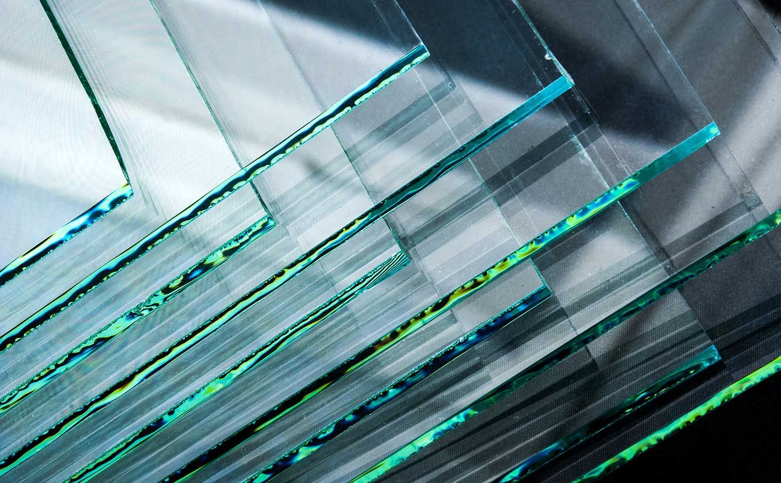 A close up of a stack of glass pieces on a table.