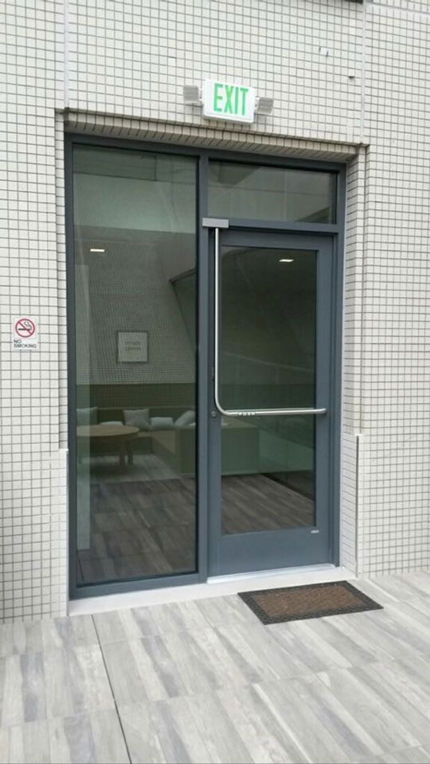 A door with a green exit sign above it