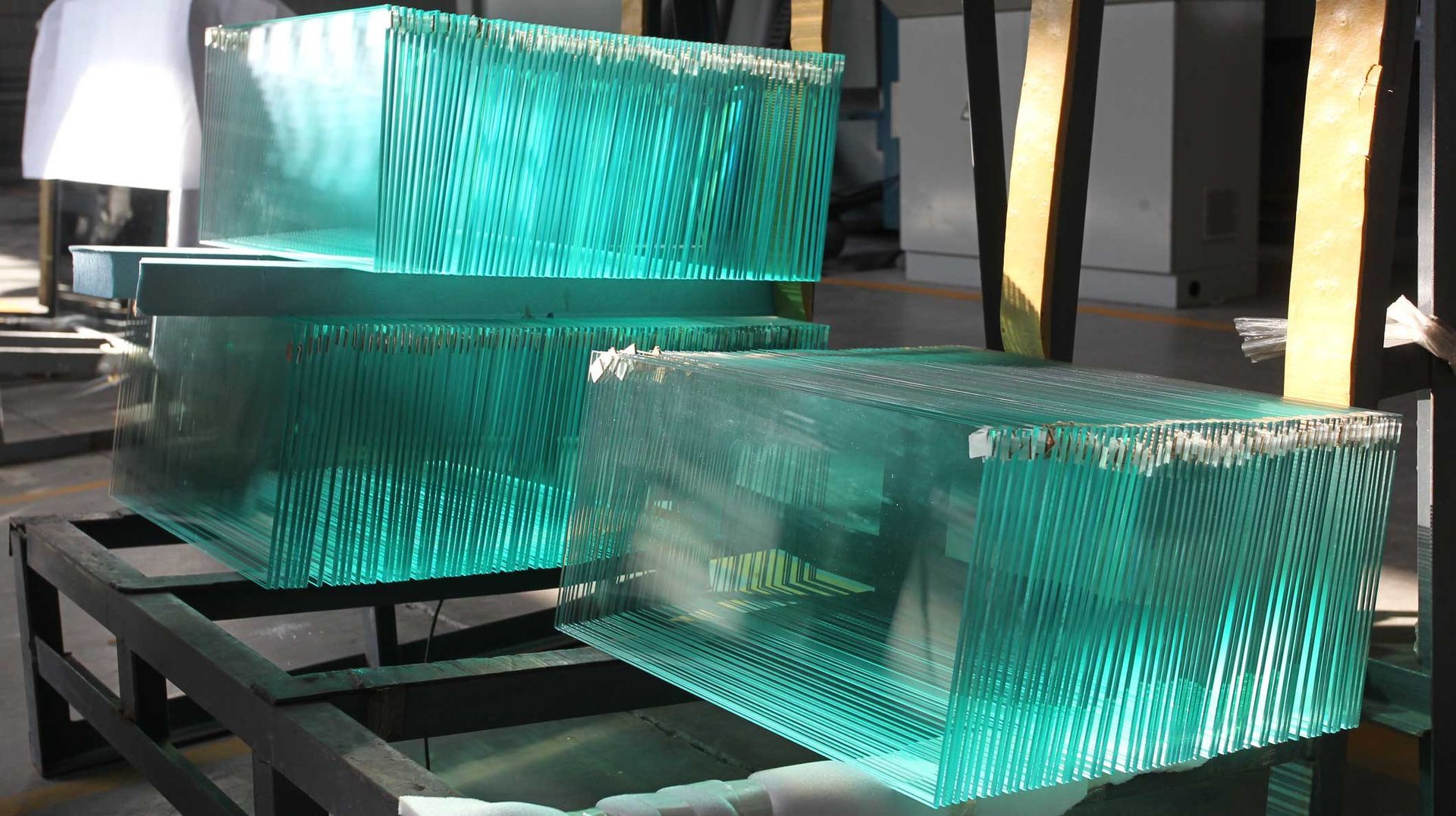 A stack of green glass blocks sitting on top of each other on a table.