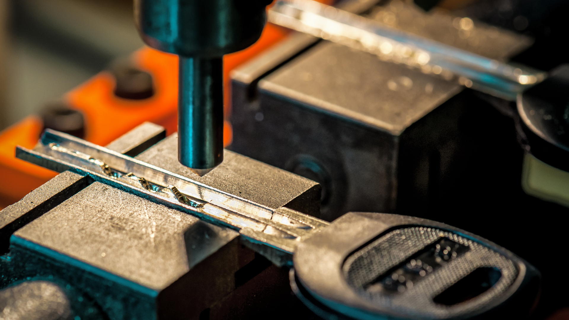 A person is using a machine to make a key