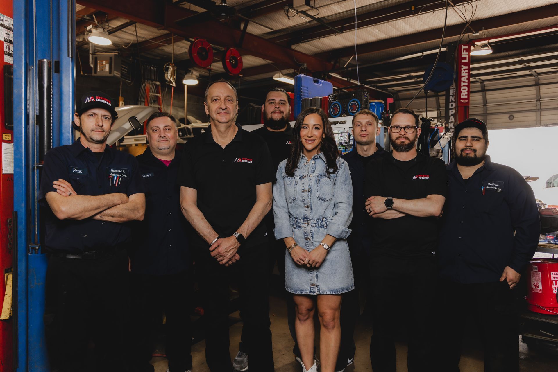 Team standing together in the shop | Northrich Automotive