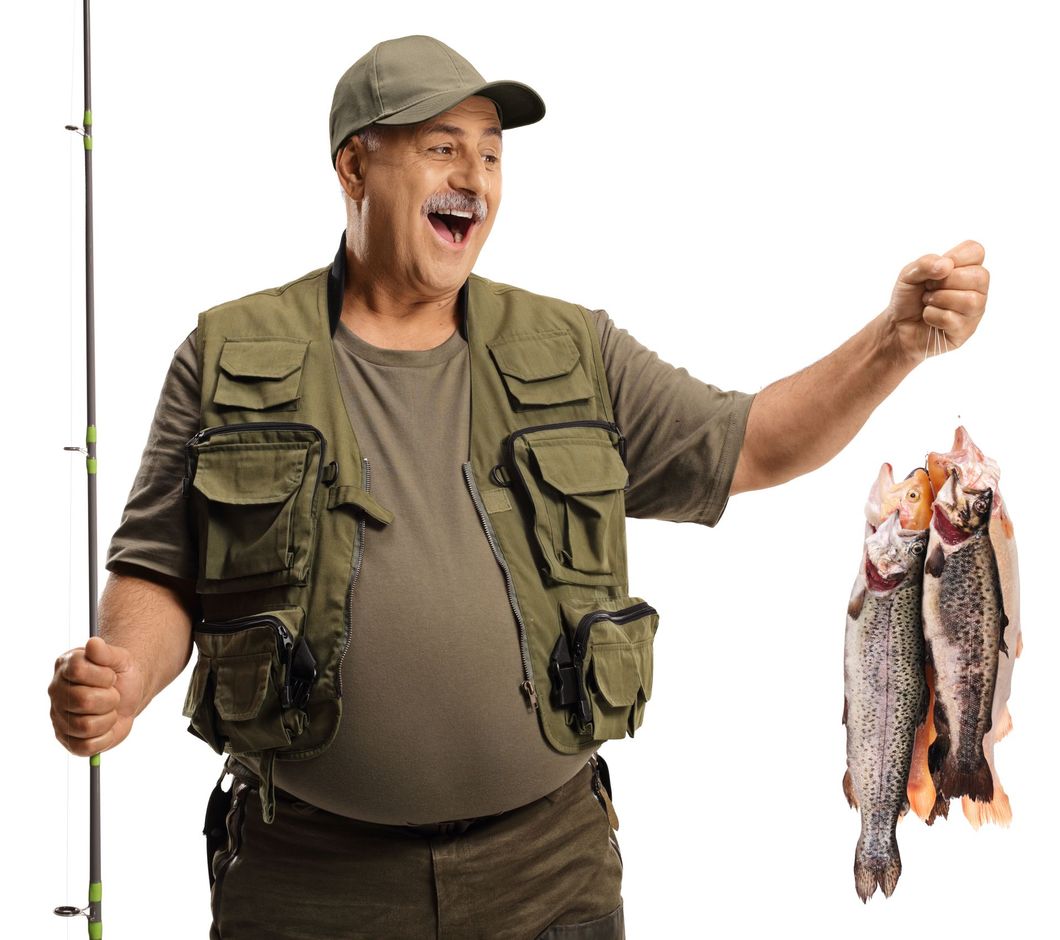 Smiling angler in green vest and cap holds a fishing rod and a string of fresh fish on a white background