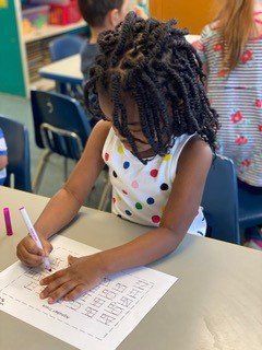 Little Girl Learns Handwriting