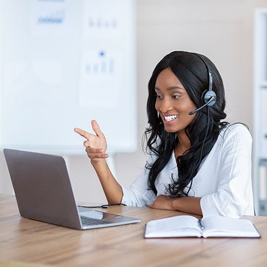 Virtual Staff in front of her laptop