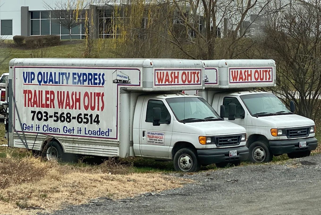 Two white trucks, labeled 