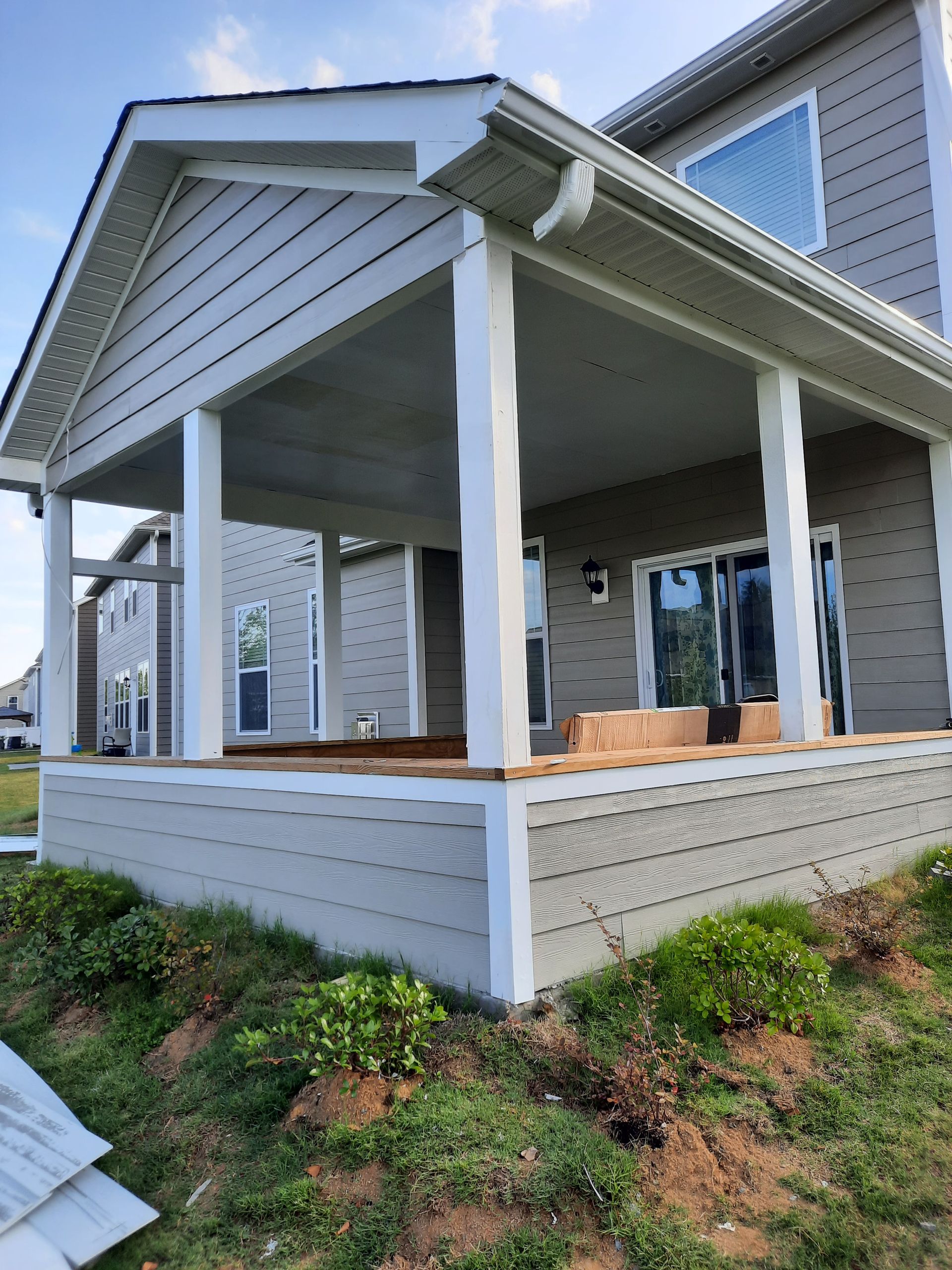 A house with a porch and a couch on it.