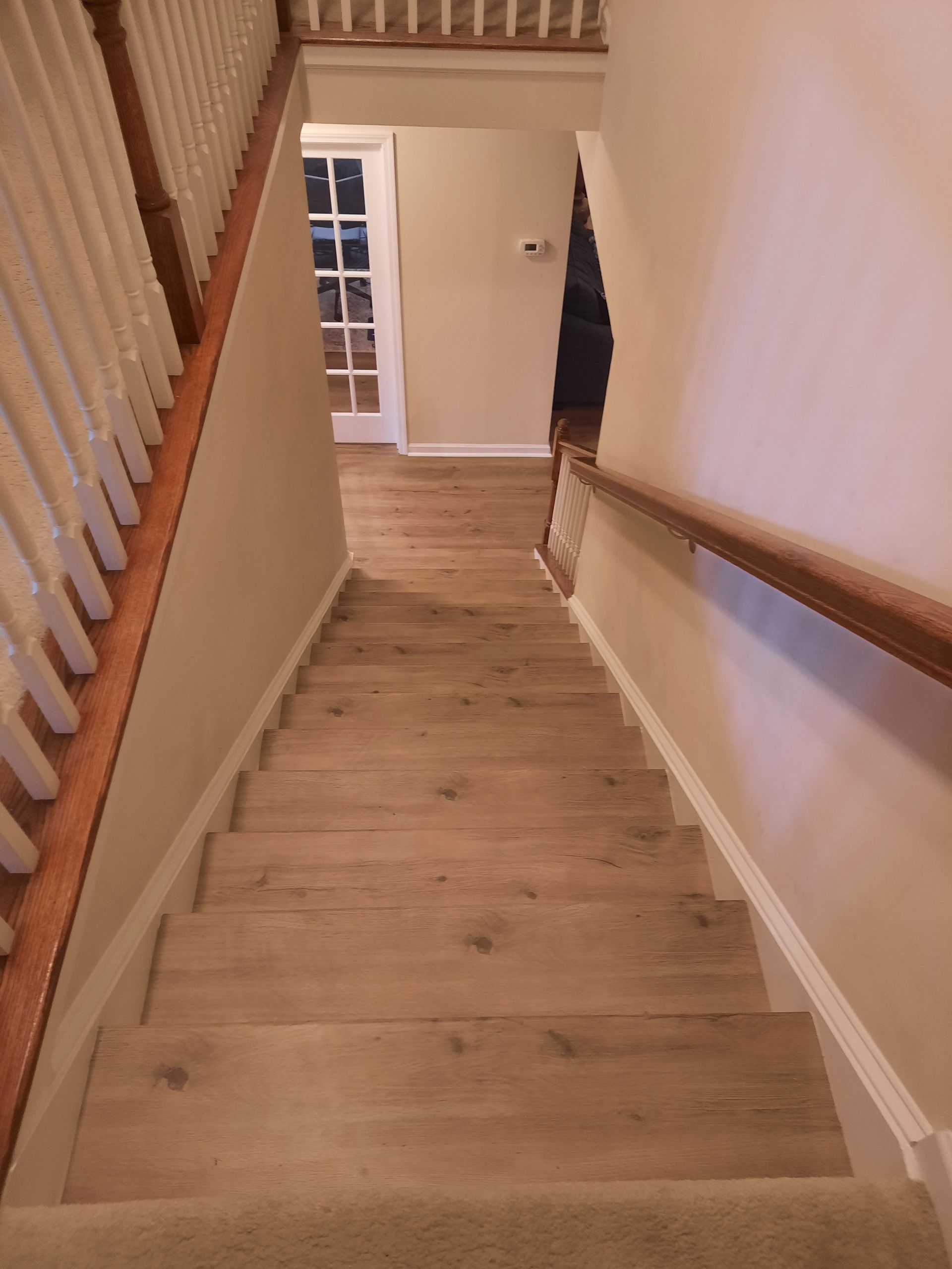 A set of stairs leading up to the second floor of a house.