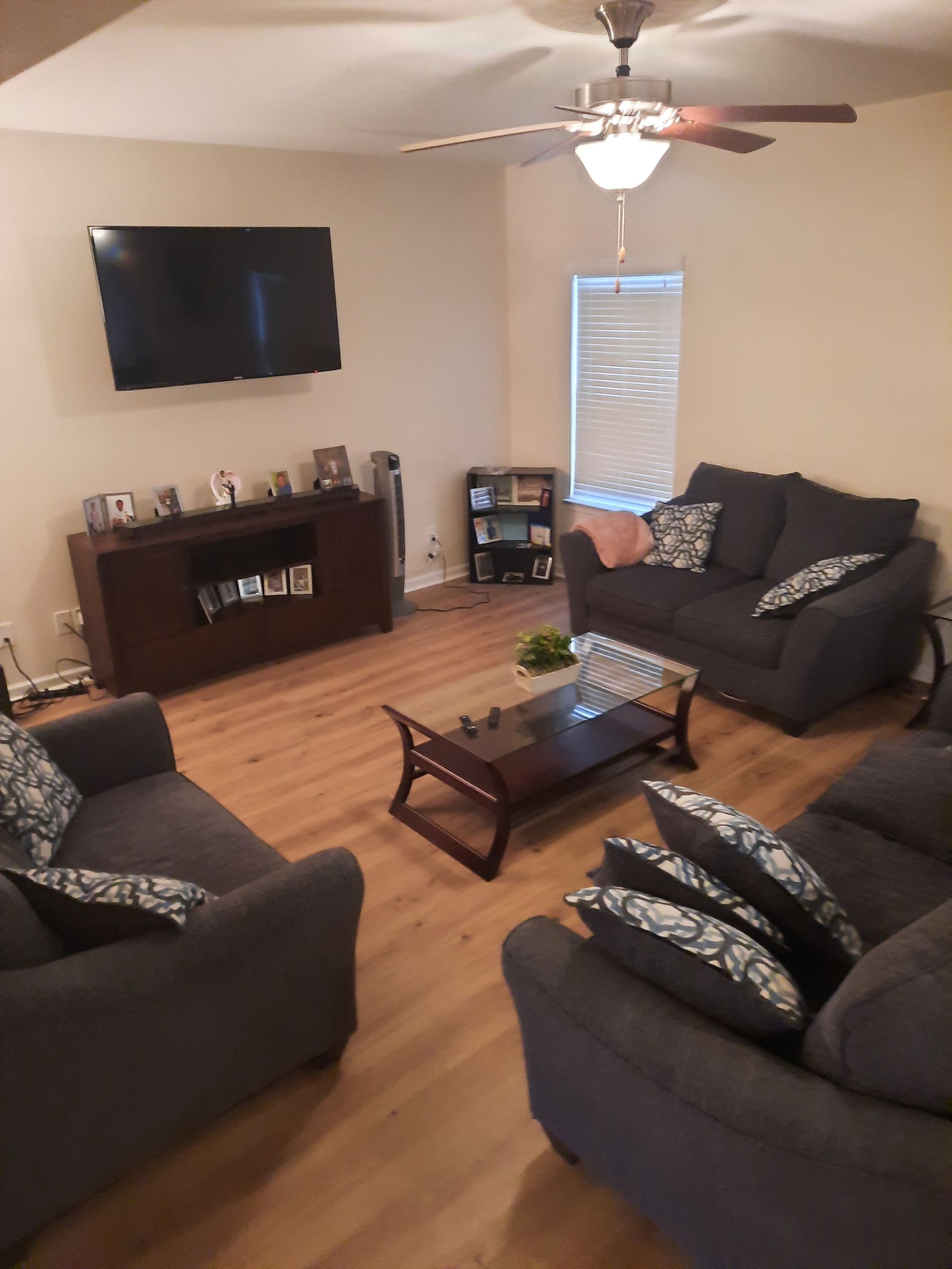 A living room filled with furniture and a flat screen tv