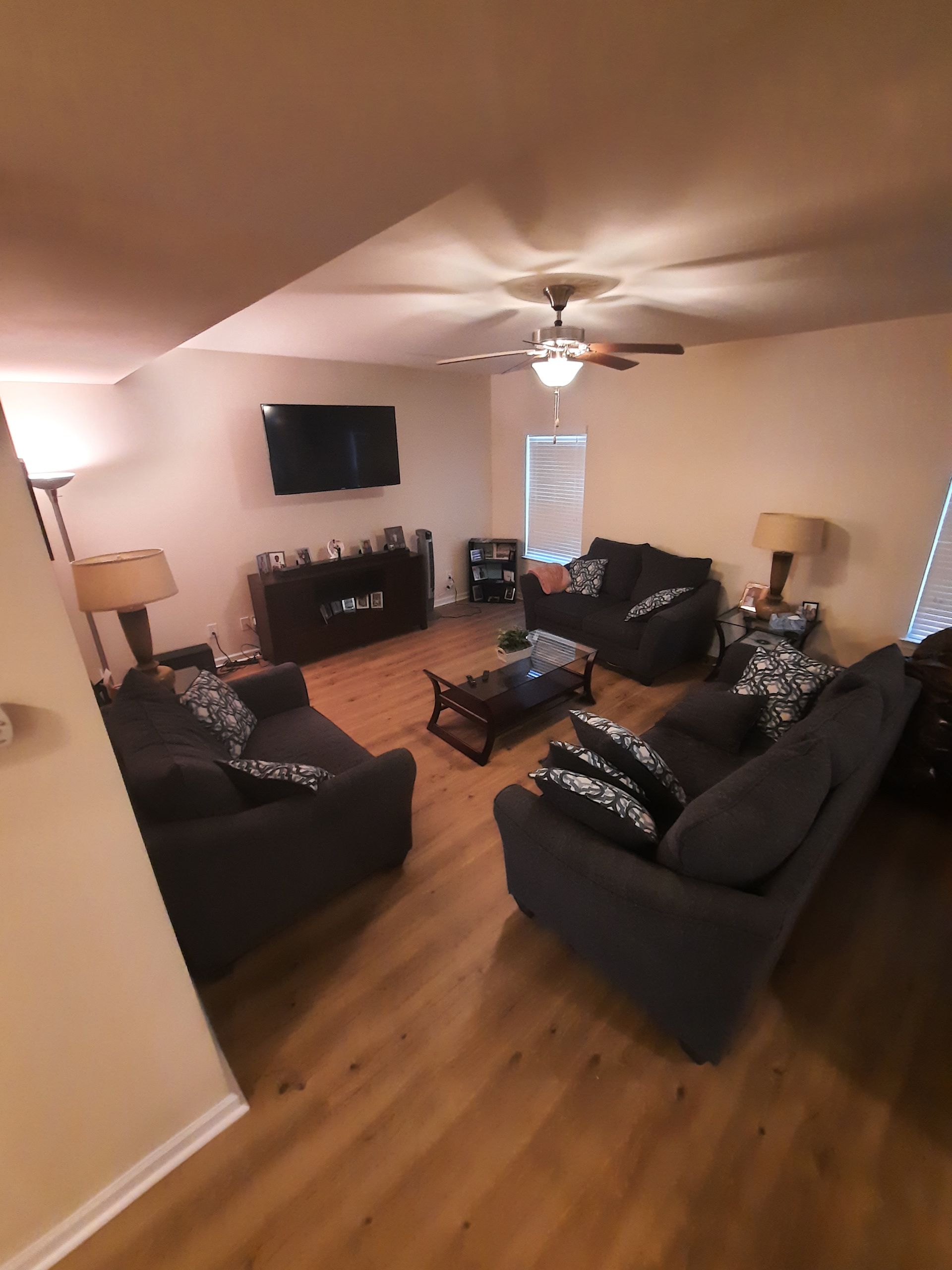 A living room filled with furniture and a flat screen tv