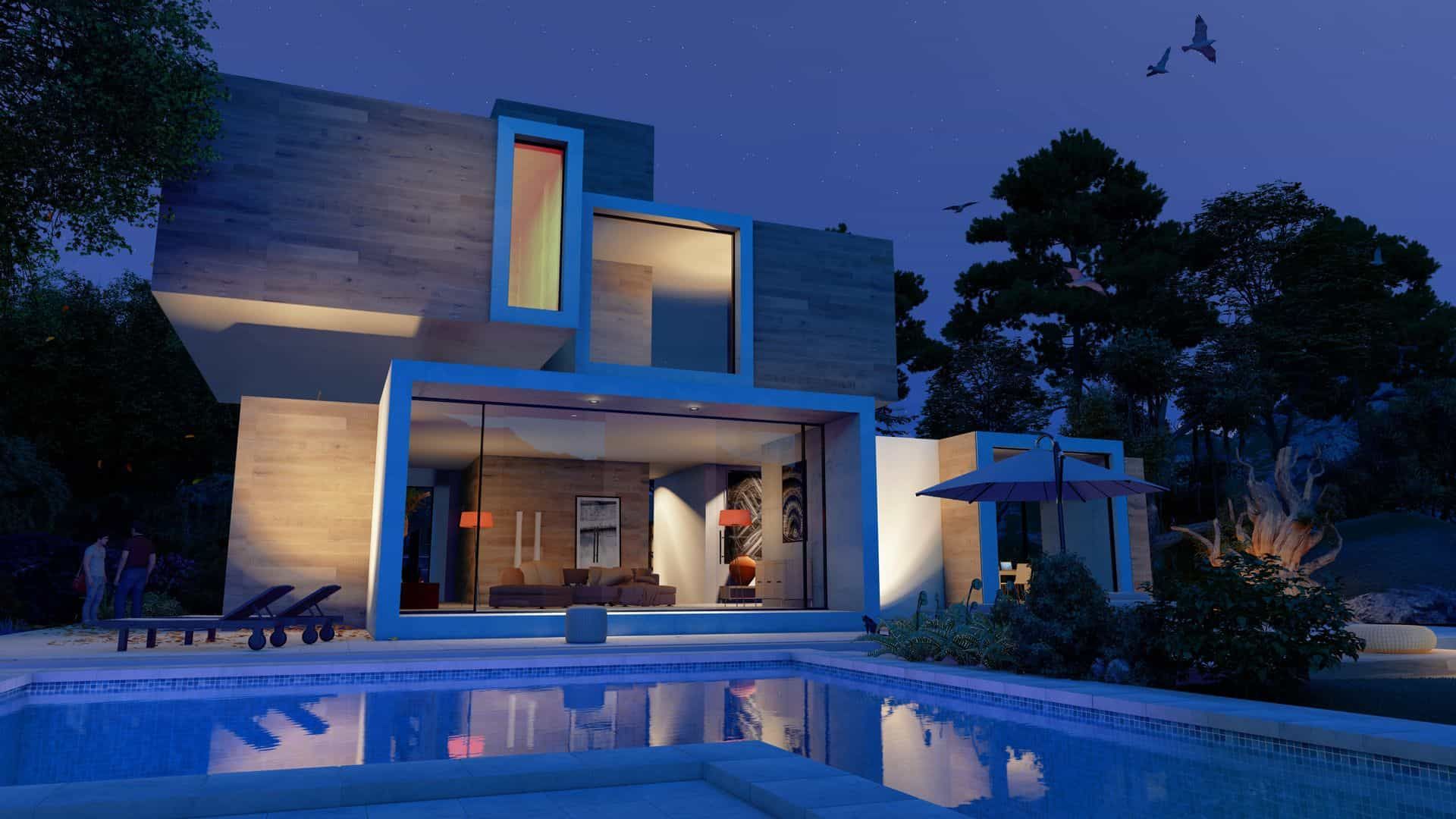 A modern house with a swimming pool in front of it at night.