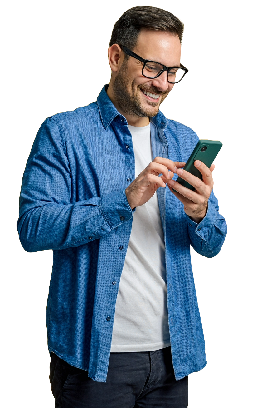 A Man Wearing a Denim Jacket Smiles While Looking at Phone — Boca Raton, FL  — Smart Carpet and Tile