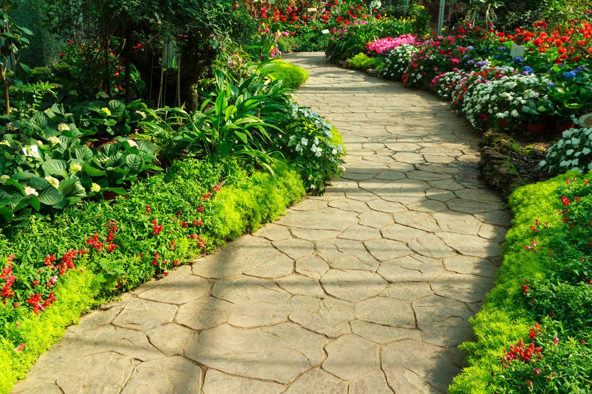 Stone Walkway in Flower Garden — Sandy, UT — Ironwood Landscaping LLC
