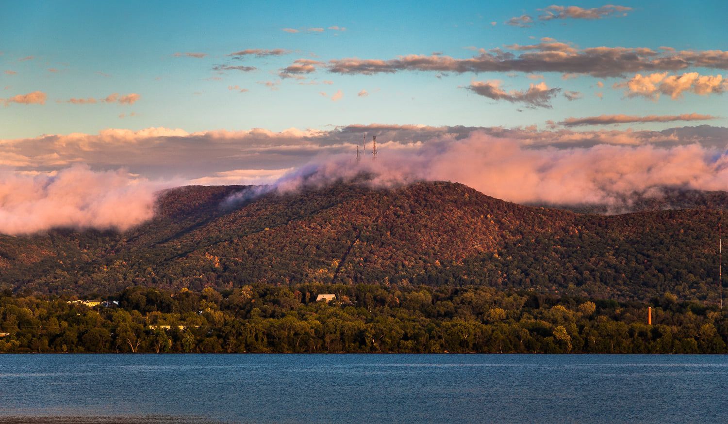 a view of a lake with a mountain in the background - John Morizen