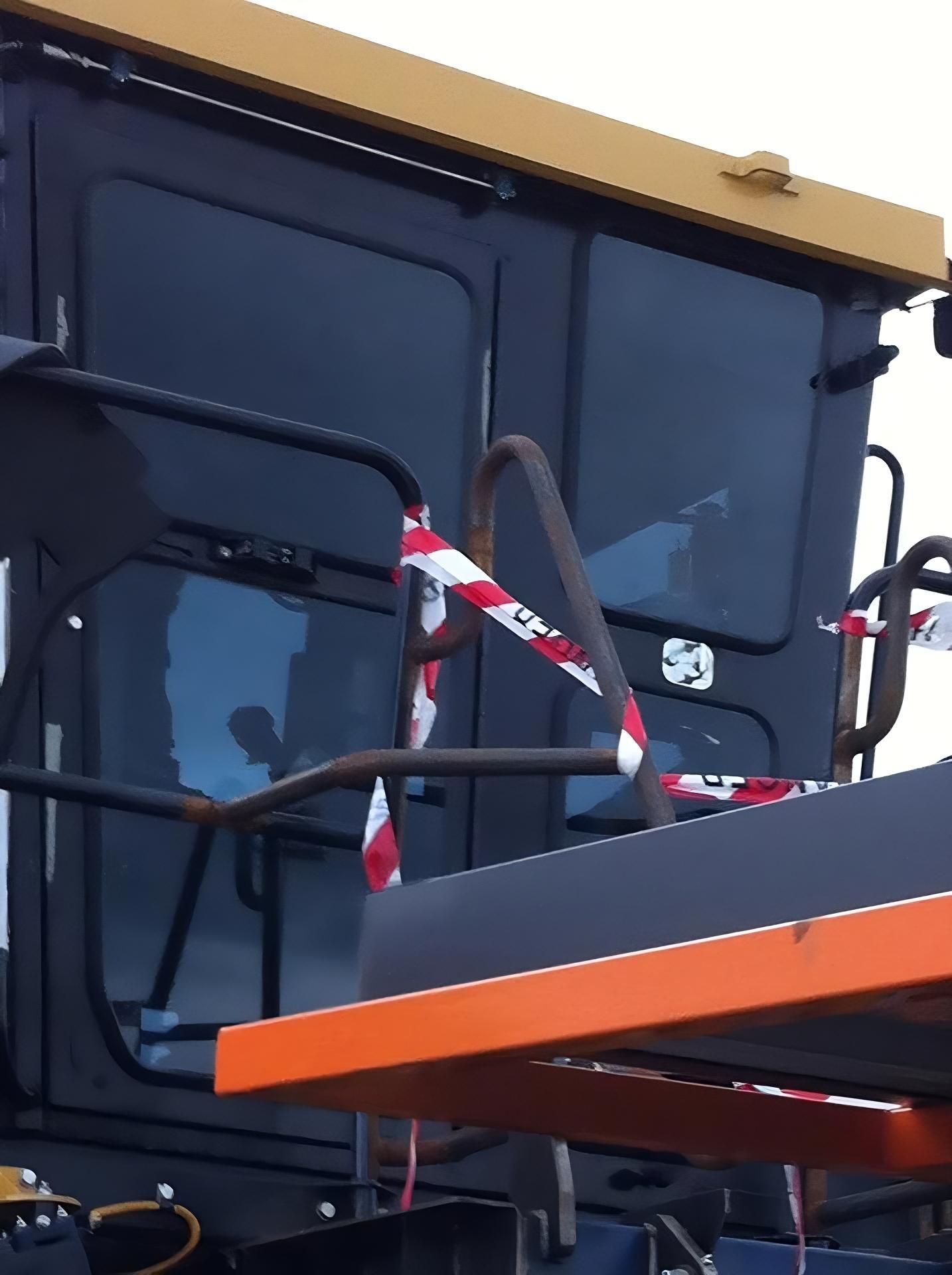 A Close up Of a Tractor with A Red White and Blue Tape Around It — Epic Window Tinting in Glenella, QLD