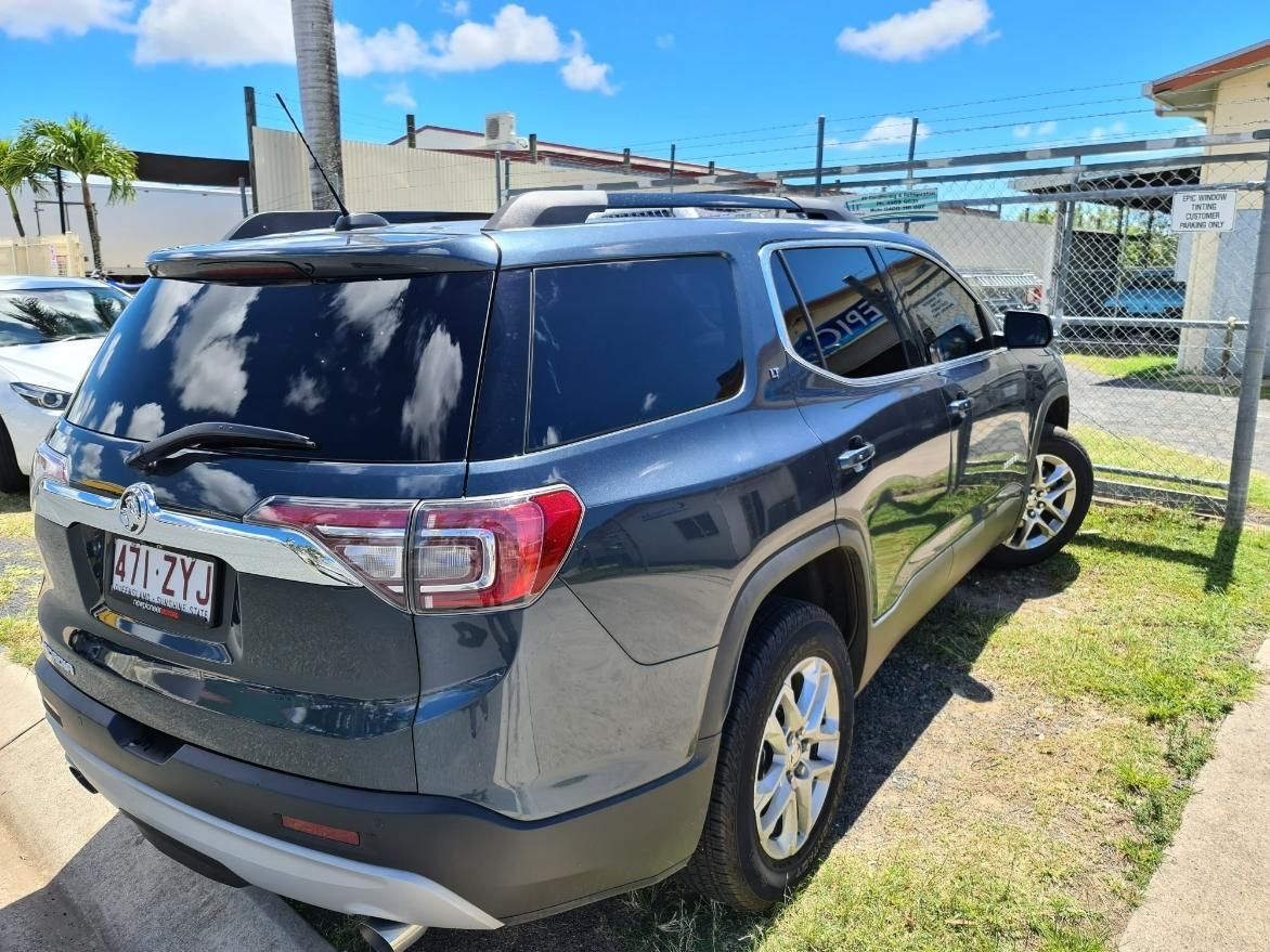 A Gray Suv Is Parked in A Grassy Area β Epic Window Tinting in Glenella, QLD