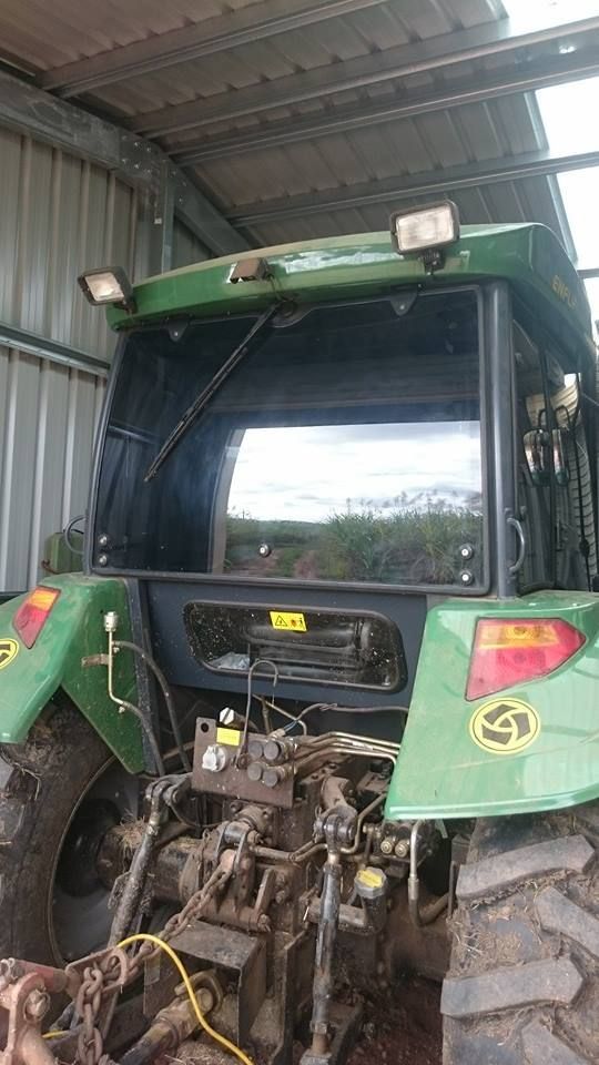 A Green Tractor is Parked in a Shed β Epic Window Tinting in Glenella, QLD