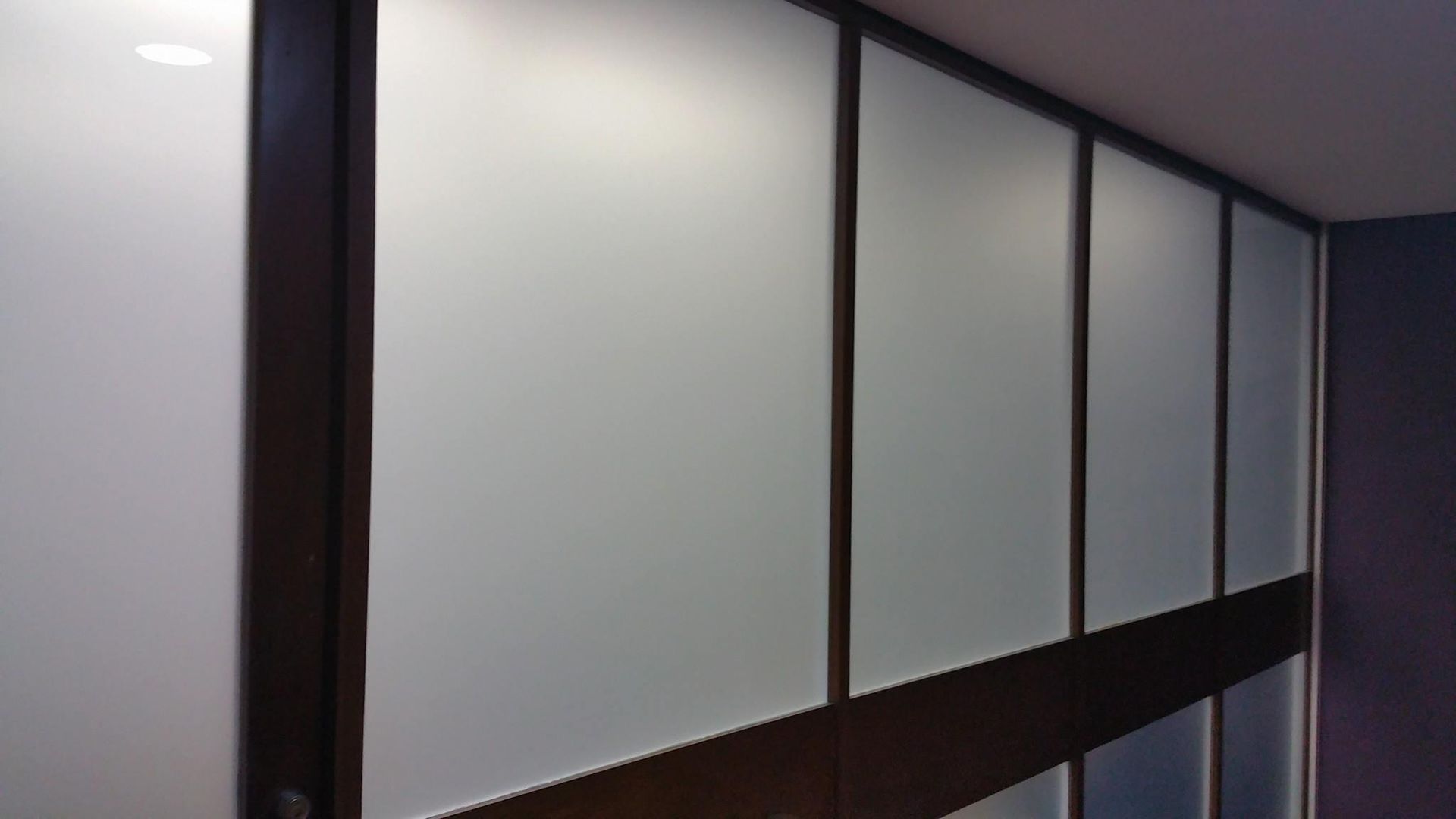 A Row of White Walls with Wooden Trim in A Room β Epic Window Tinting in Glenella, QLD