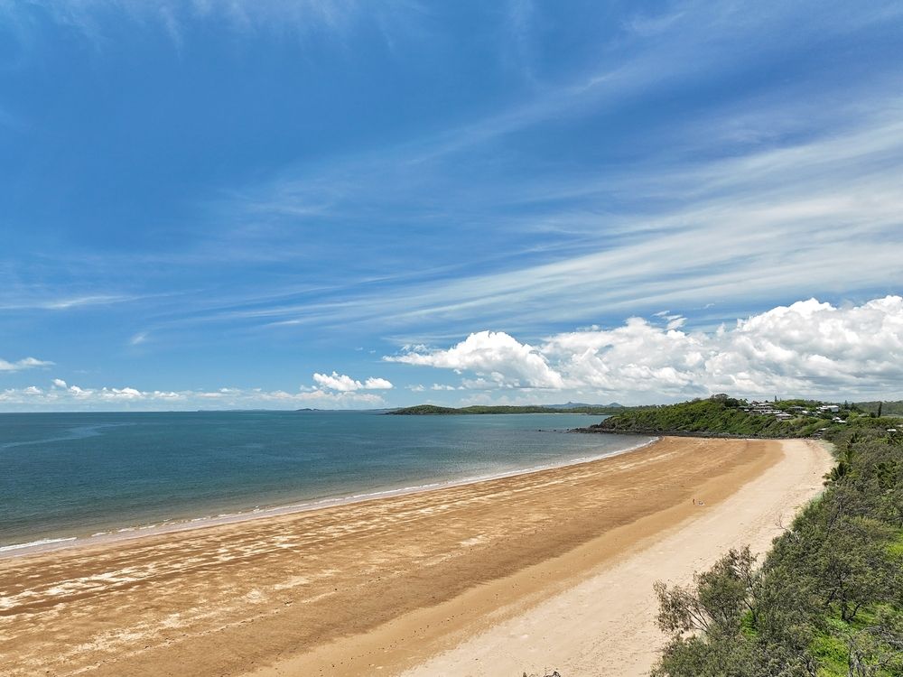A Long Sandy Beach Next to The Ocean on A Sunny Day β Epic Window Tinting in Sarina, QLD