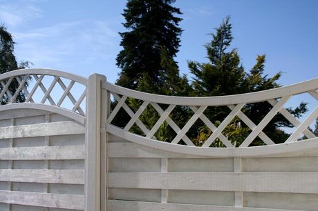Curved timber paling fence with a lattice extension
