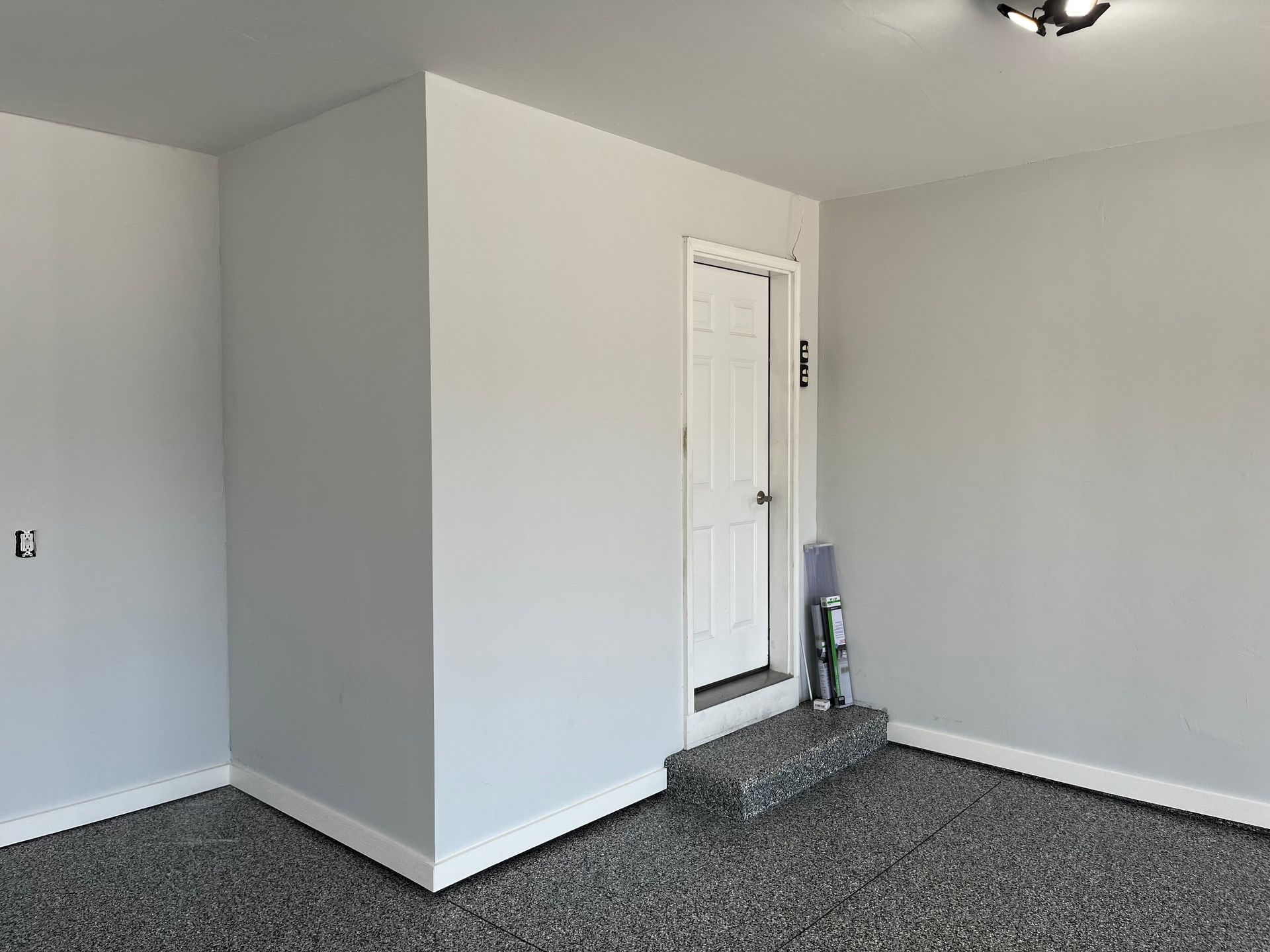 There is a door in the corner of the room.