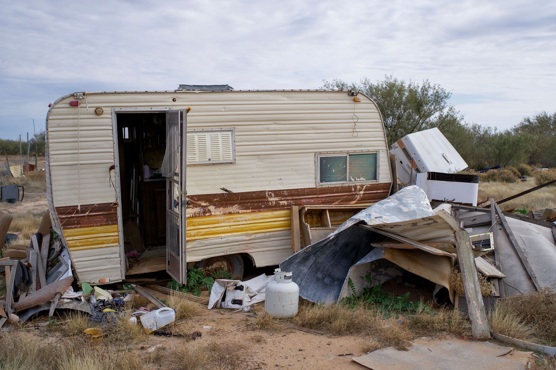 Pile of junk being removed for Yard Waste, Storm Damage & Outdoor Debris Removal