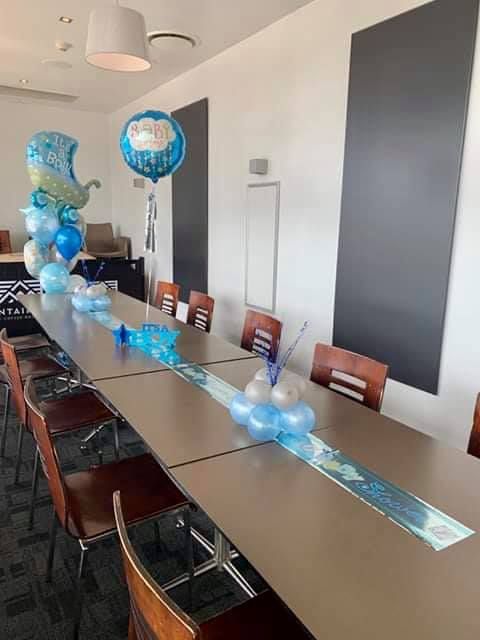 A Long Table with Balloons on It in A Room — Creative Events Innisfail in Innisfail, QLD