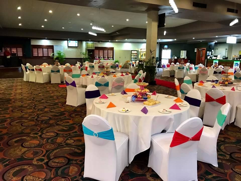A Large Room with Tables and Chairs Set up For a Wedding Reception — Creative Events Innisfail in Mission Beach, QLD