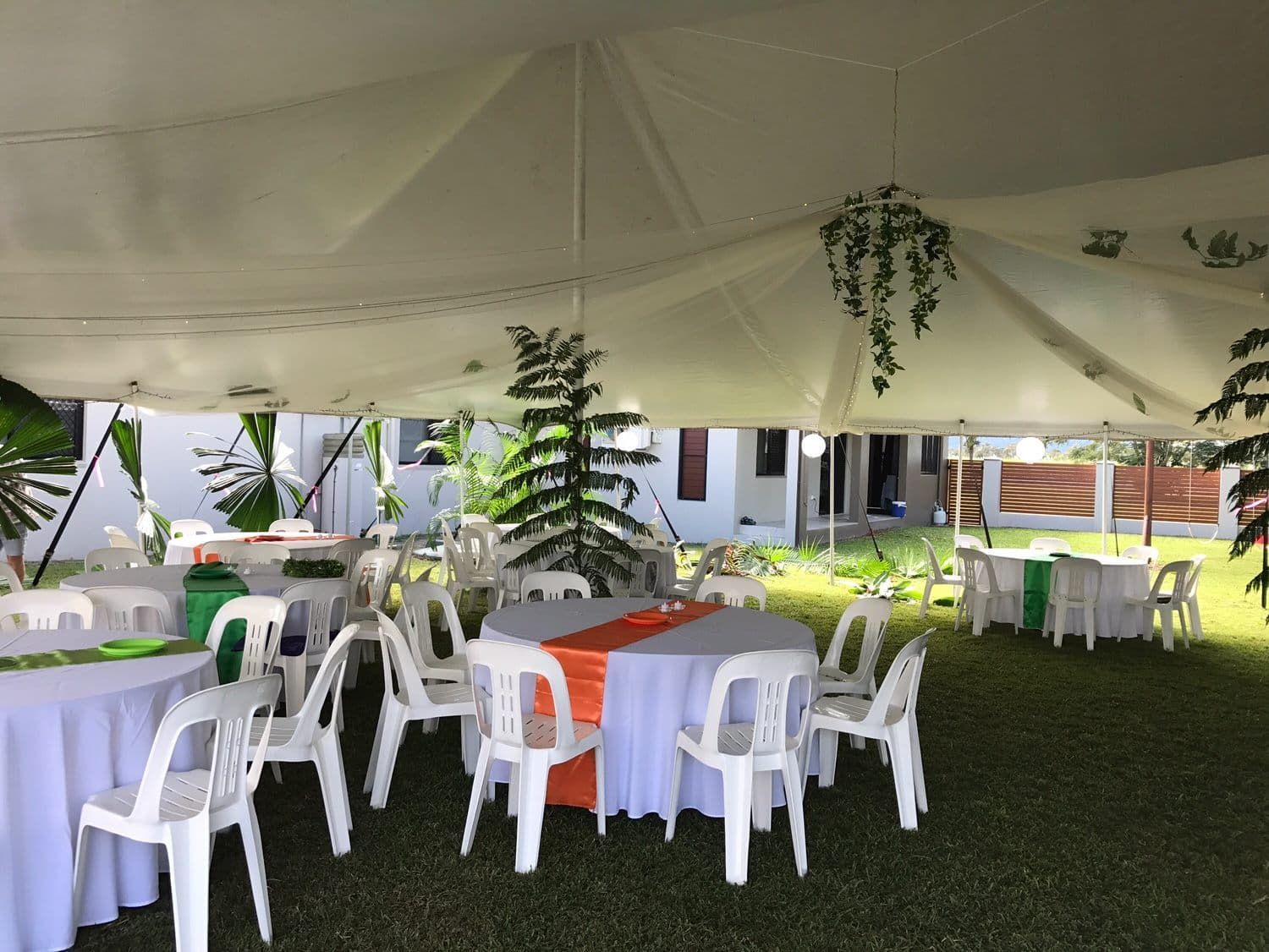 A Tent with Tables and Chairs Underneath It — Creative Events Innisfail in Mission Beach, QLD