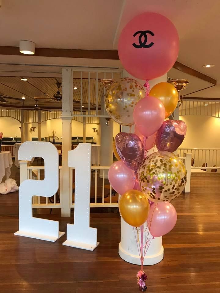 A Bunch of Pink and Gold Balloons with A Chanel Logo on Them — Creative Events Innisfail in Tully, QLD