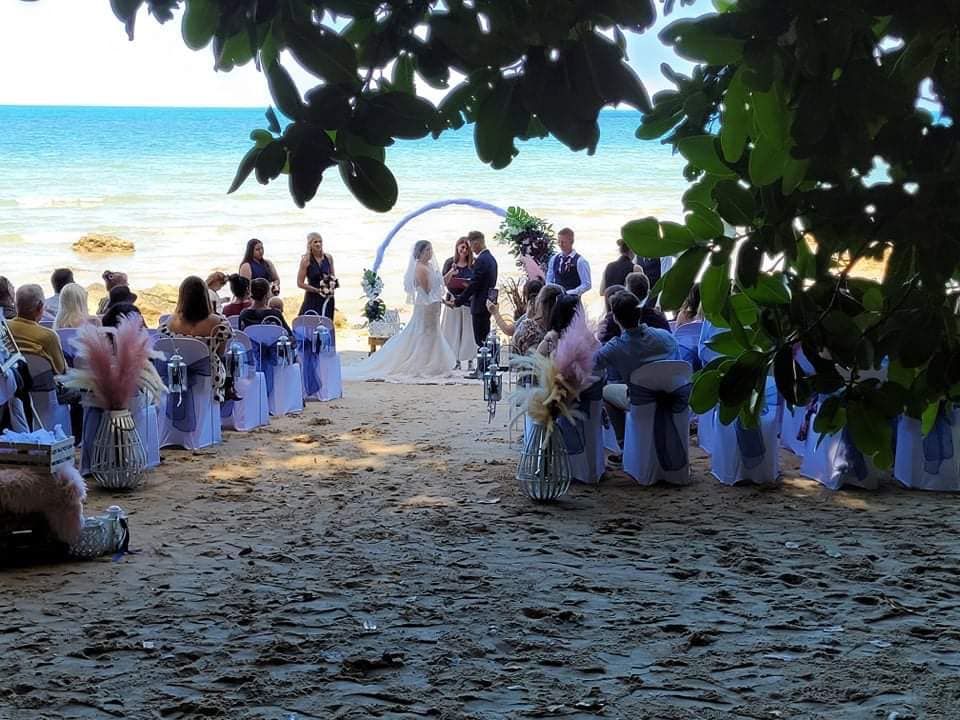 A Wedding Ceremony Is Taking Place on The Beach — Creative Events Innisfail in Innisfail, QLD