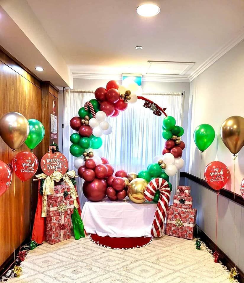 A Room Decorated for Christmas with Balloons and Gifts — Creative Events Innisfail in Mission Beach, QLD
