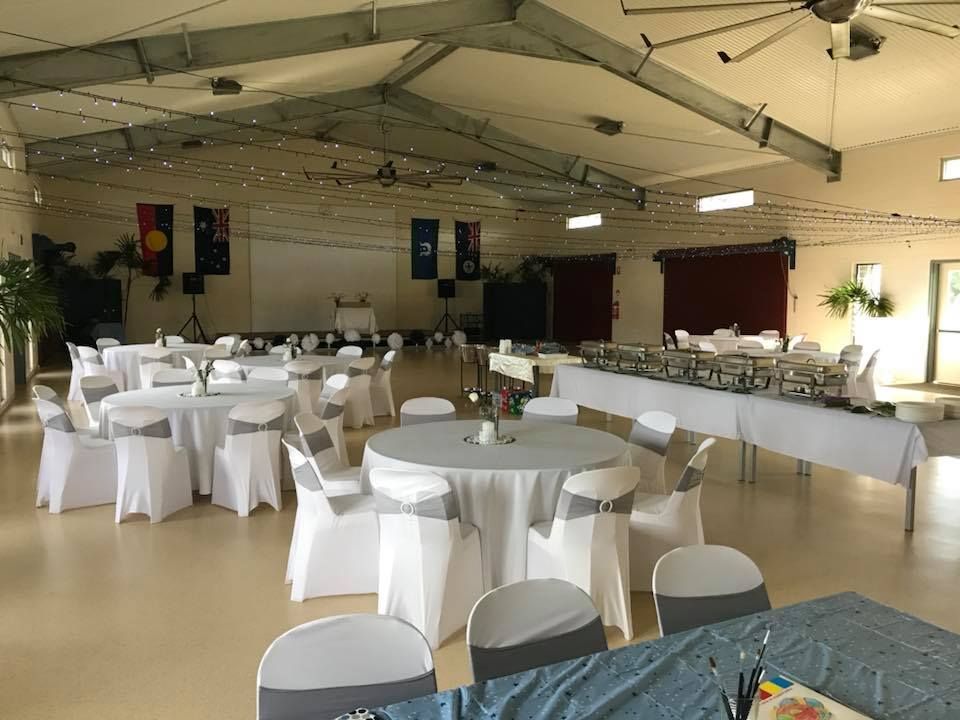A Large Room with Tables and Chairs Set up For a Wedding Reception — Creative Events Innisfail in Babinda, QLD