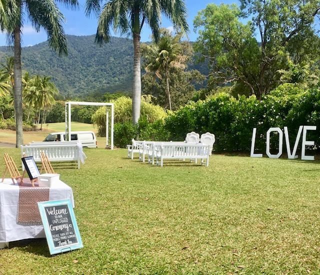 A Large Love Sign Is Sitting in The Middle of A Grassy Field — Creative Events Innisfail in Tully, QLD