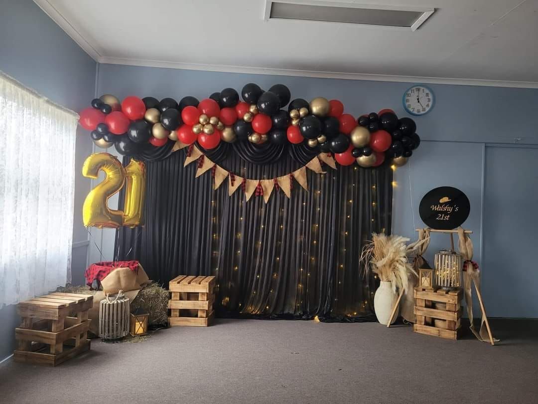 A Room Decorated with Balloons and A Sign that Says 21 — Creative Events Innisfail in Mission Beach, QLD