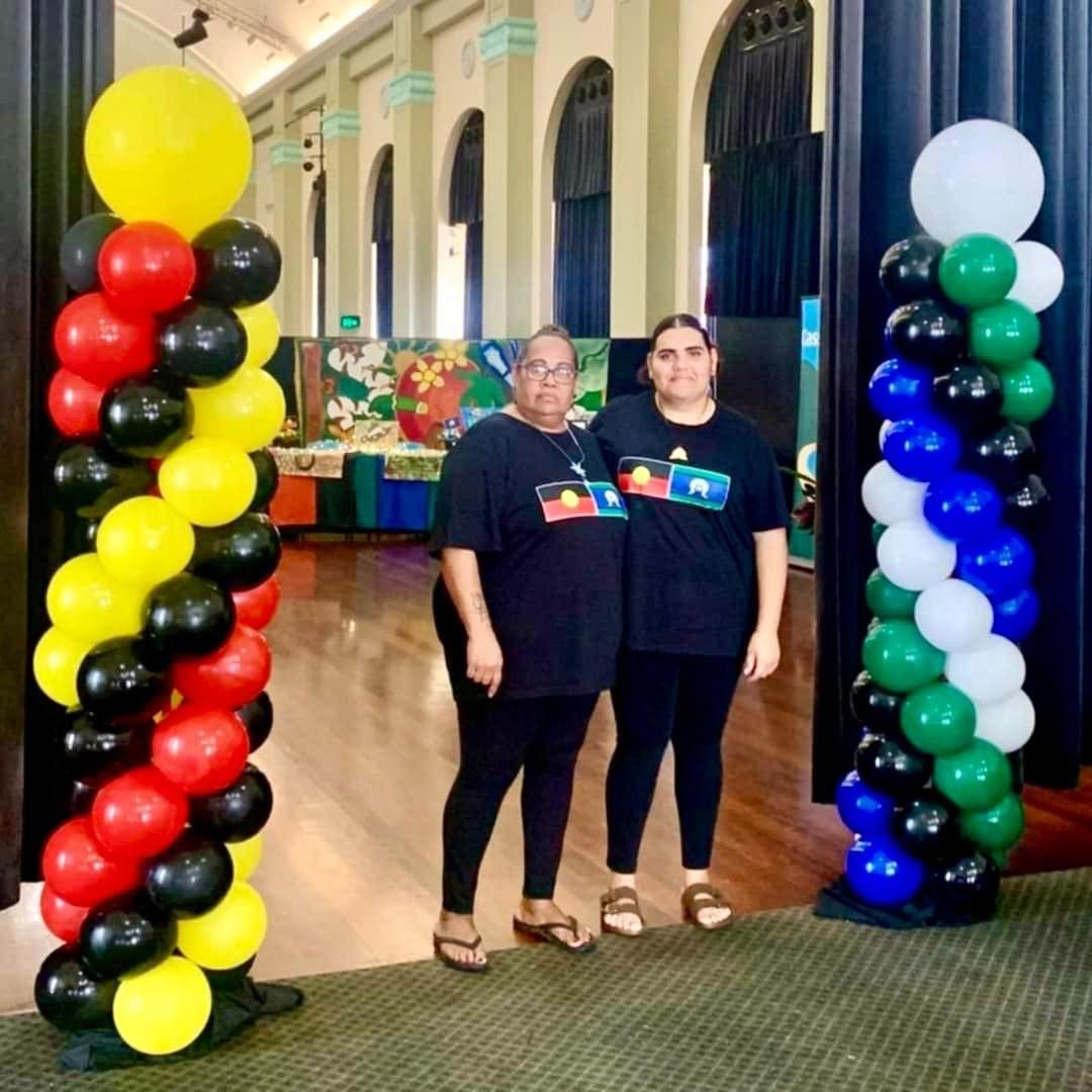 Two Women Standing Next to Each Other in Front of Balloons — Creative Events Innisfail in Babinda, QLD