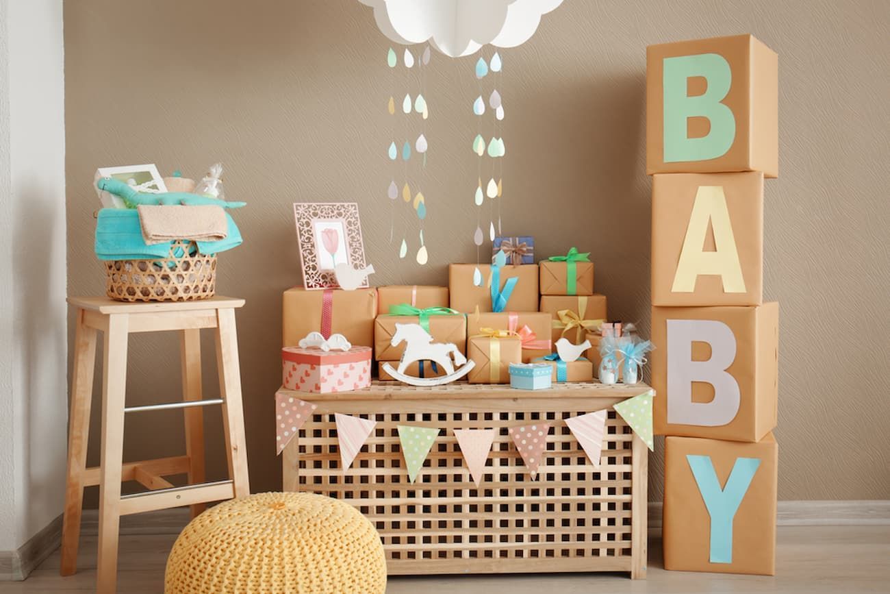 A Room Decorated for A Baby Shower with Lots of Toys and Gifts — Creative Events Innisfail in Innisfail, QLD