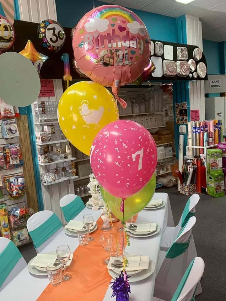 A Table with A Bunch of Balloons on It — Creative Events Innisfail in Babinda, QLD