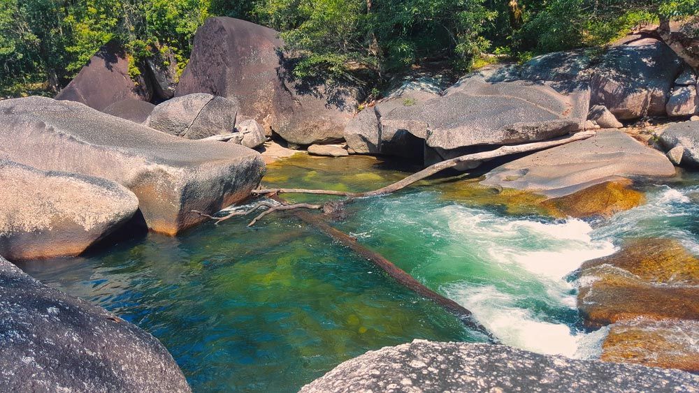 A River Surrounded by Rocks and Trees in The Woods — Creative Events Innisfail in Babinda, QLD