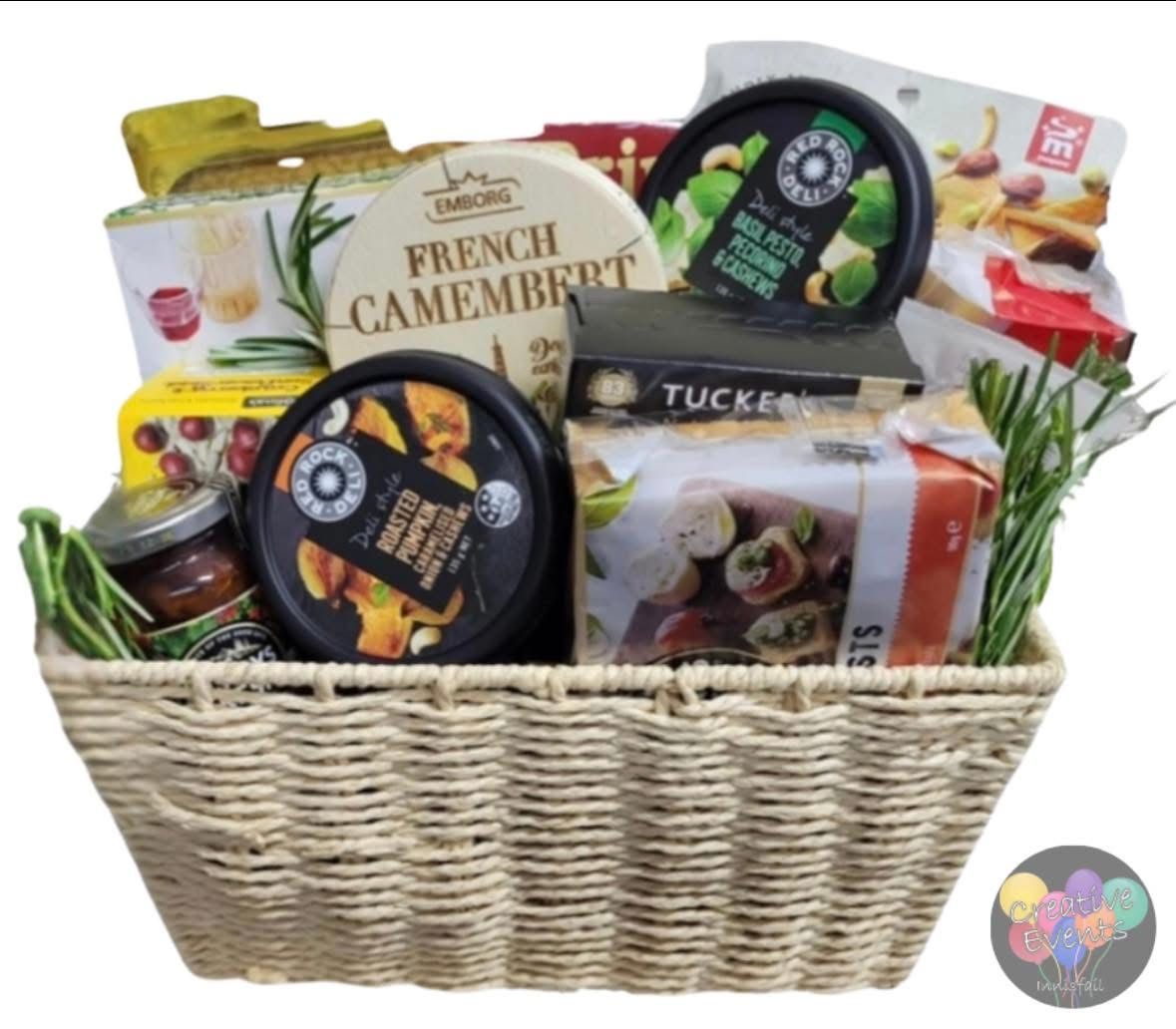 A gift hamper filled with chocolates, flowers, and wine— Creative Events Innisfail in Innisfail, QLD