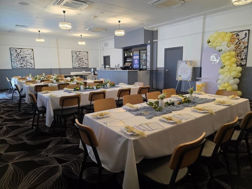 Table and chairs are set up in a room— Creative Events Innisfail in Innisfail, QLD