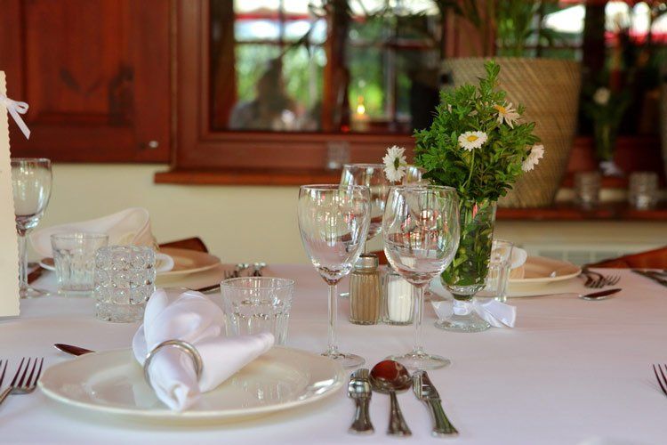 Table with Glass, Plates and Utensils — Creative Events Innisfail in Innisfail, QLD 
