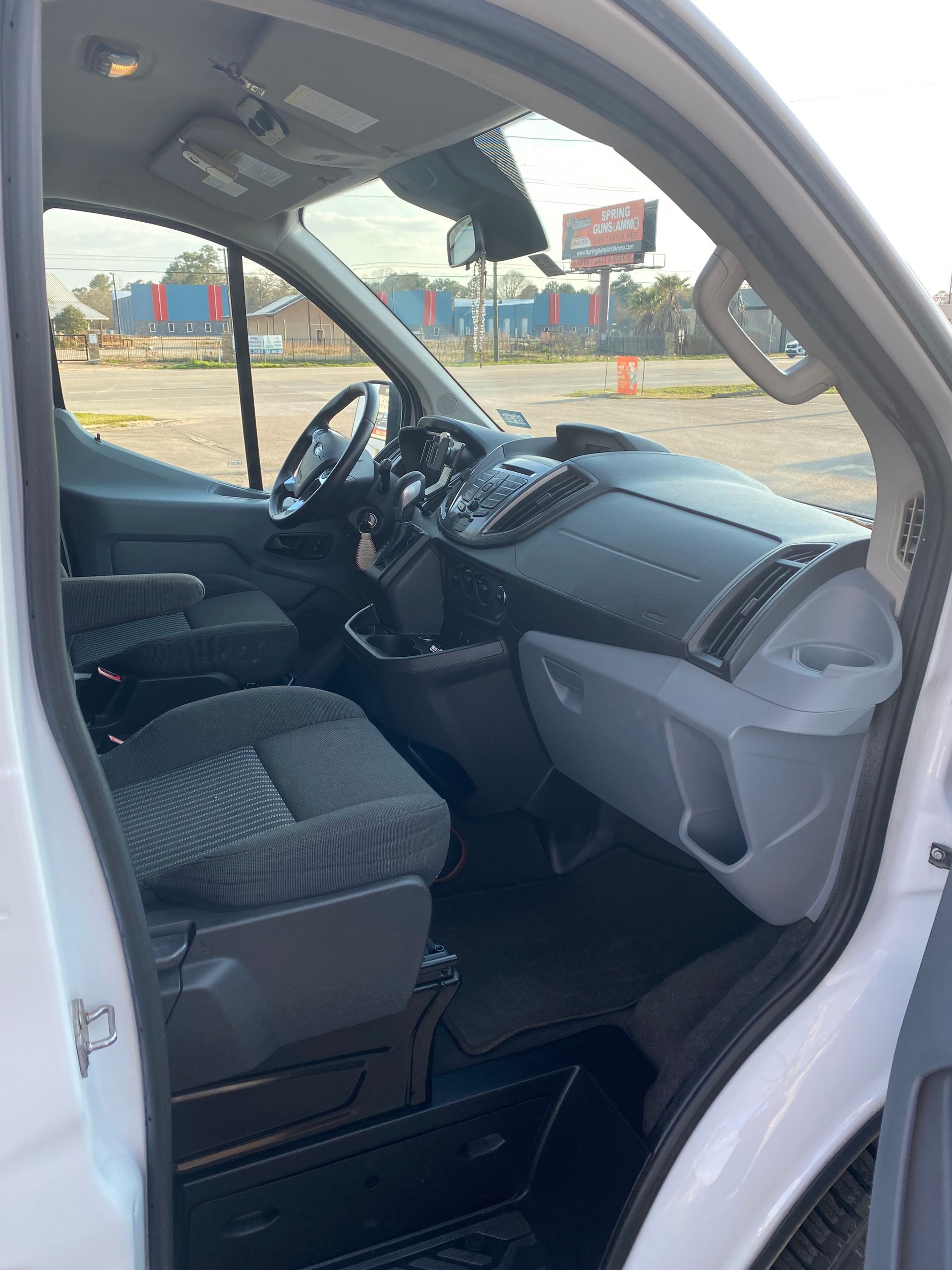 The inside of a white van with the door open.