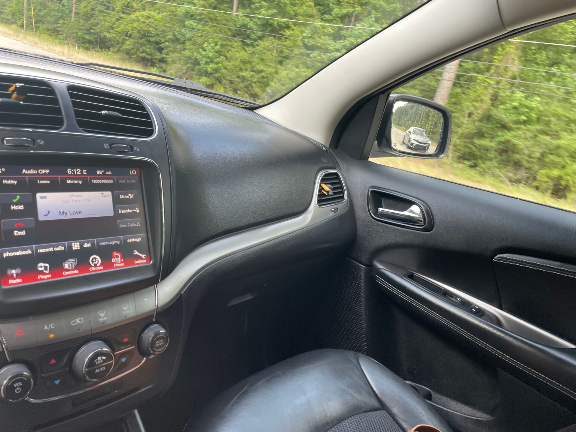 The inside of a car with a dashboard and a radio